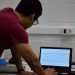 Clinical neurophysiologist reviewing EEG waveform data